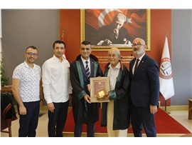 AV. ŞARMAN TOROĞLU'NA MESLEKTE 60. YIL PLAKETİ TAKDİM EDİLDİ